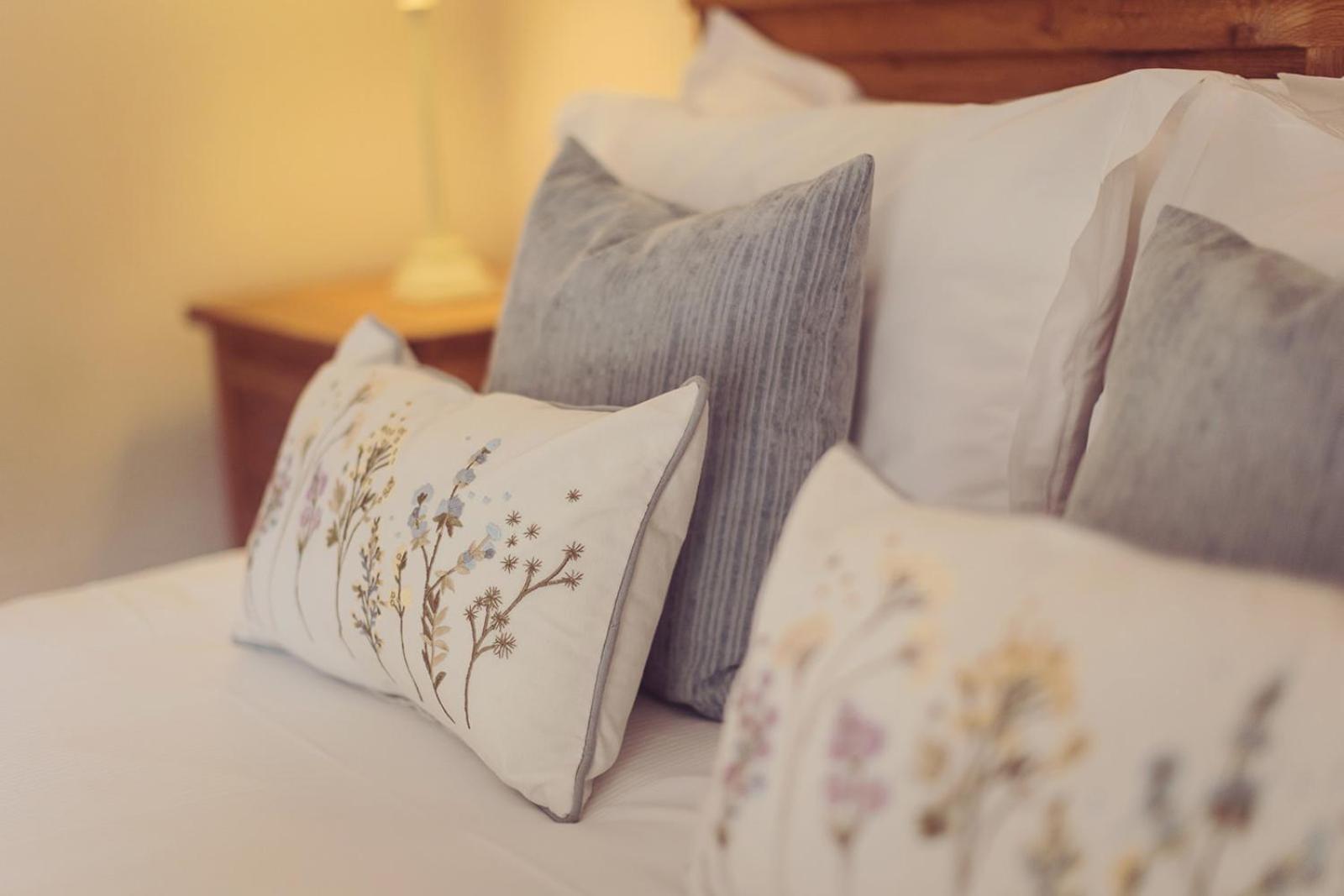 Longlands Inn & Cottages Carnforth Exterior photo Pillows on a bed